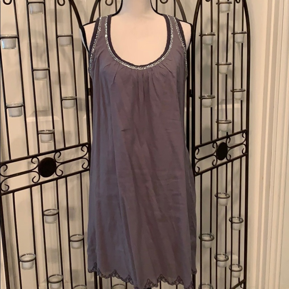Gray cotton sundress with jeweled embellishments.